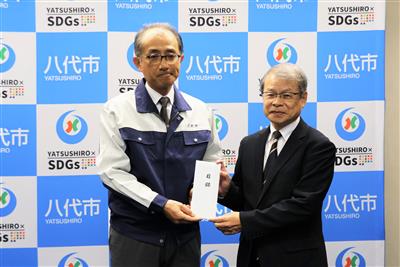 ▲平井副市長（左）と赤星専務理事（左）