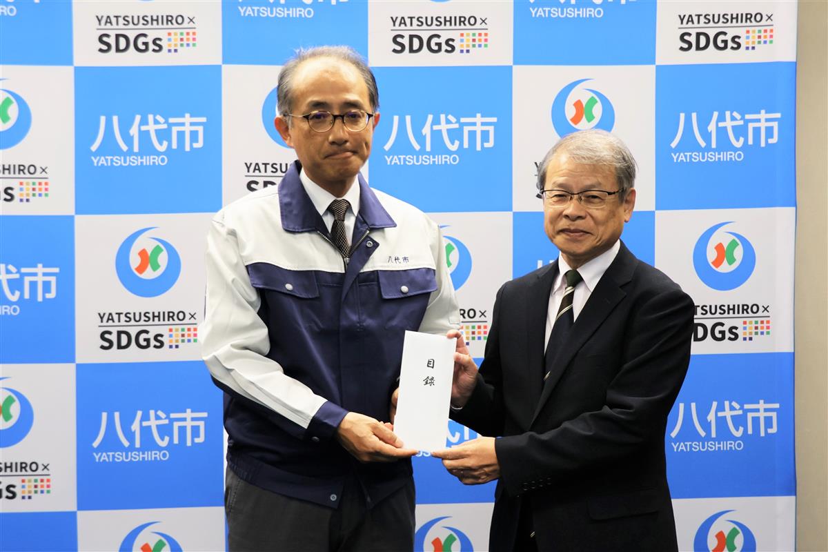 平井副市長（左）と赤星専務理事（左）の画像